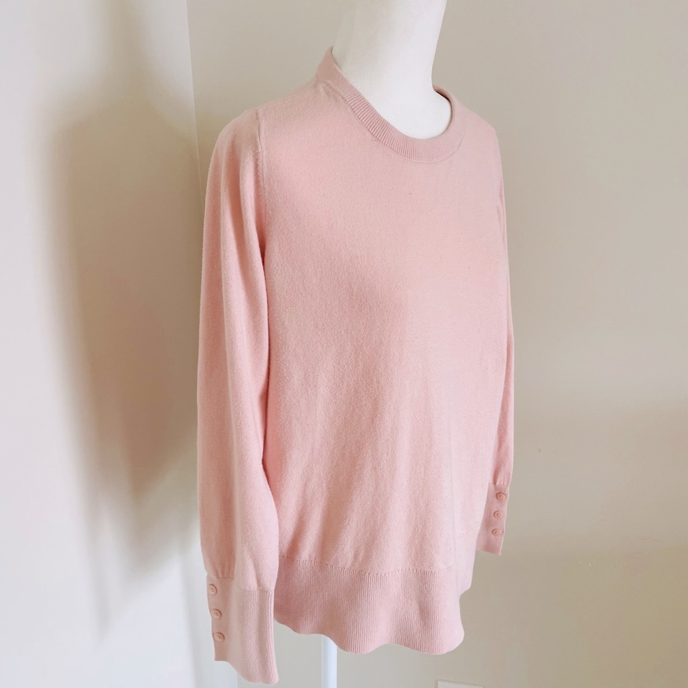 Crew neck sweater with delicate button cuff detailing